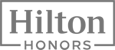 The image shows the Hilton Honors logo, with "Hilton" in bold letters within a rectangular box and "Honors" written below.
