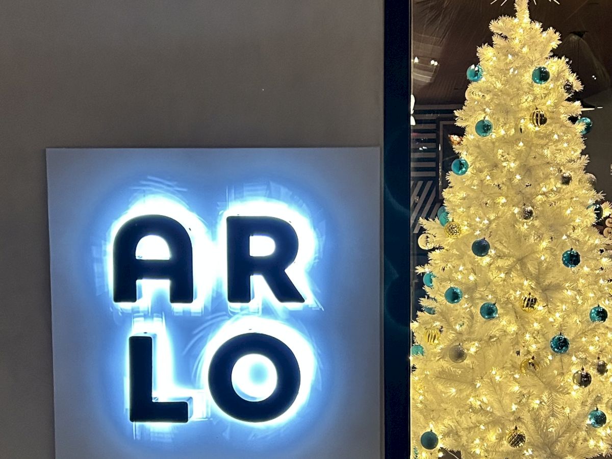 The image shows a glowing sign with the letters 